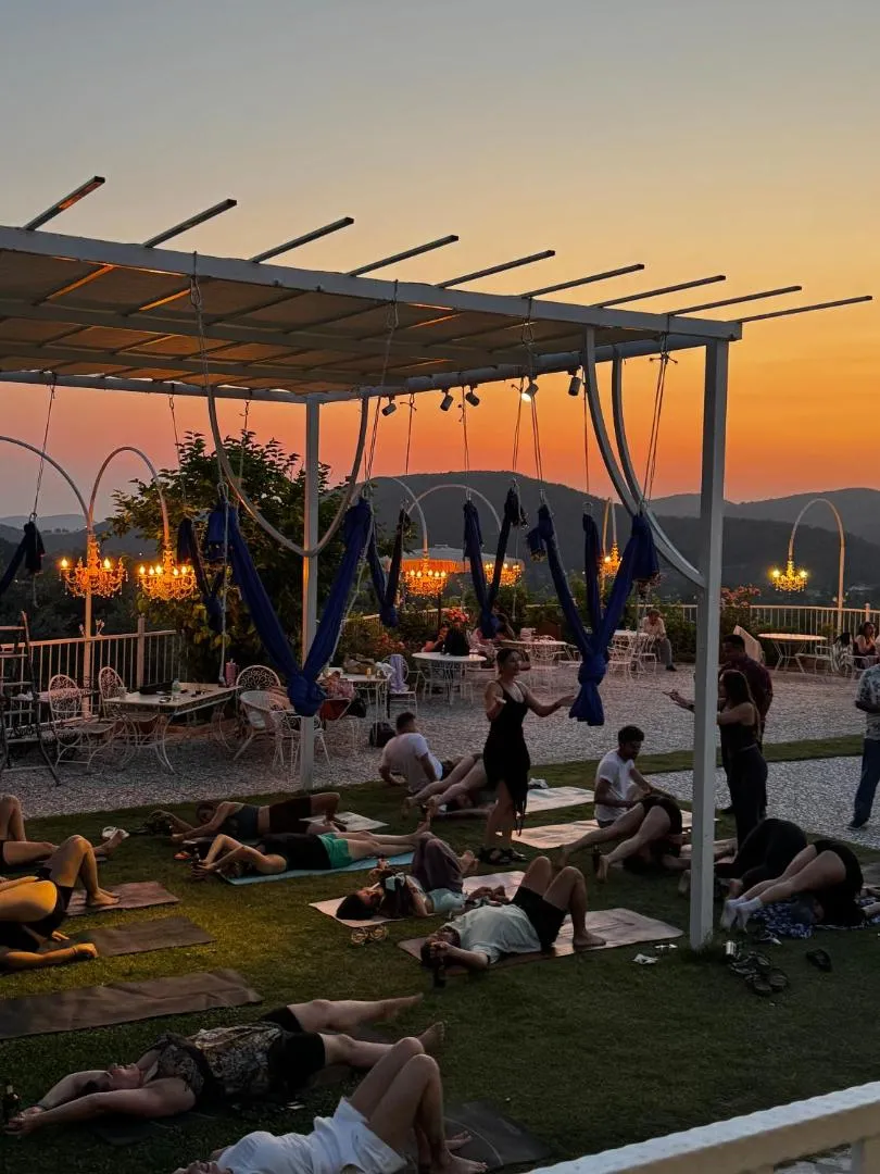 A retreat session on the terrace at Chef’s Atolye at sunset